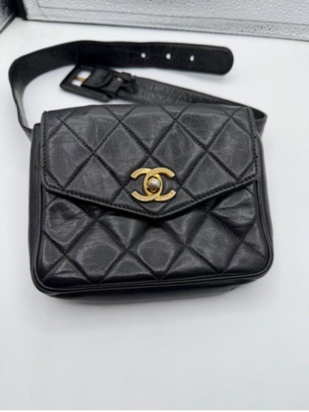 CHANEL Black Quilted Mini Belt Bag with Gold CC Logo